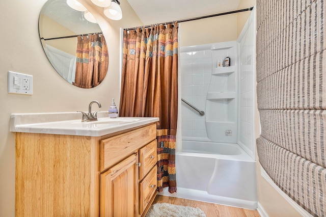 bathroom featuring shower / bath combination with curtain, wood finished floors, and vanity