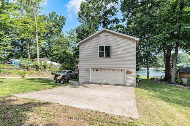 view of side of home with a garage and a lawn