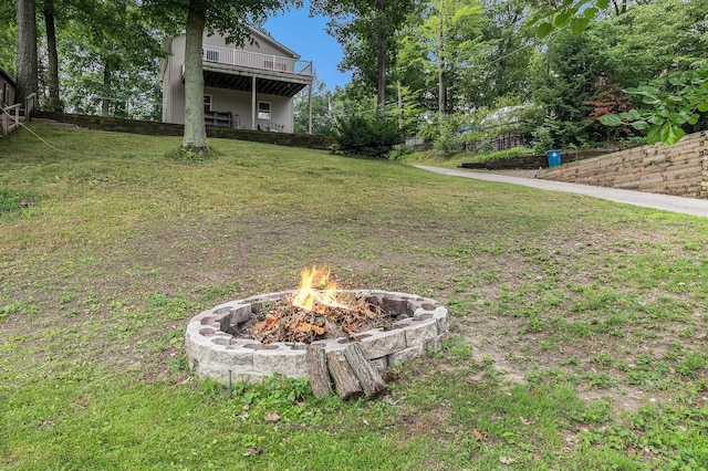 view of yard with a fire pit and a deck