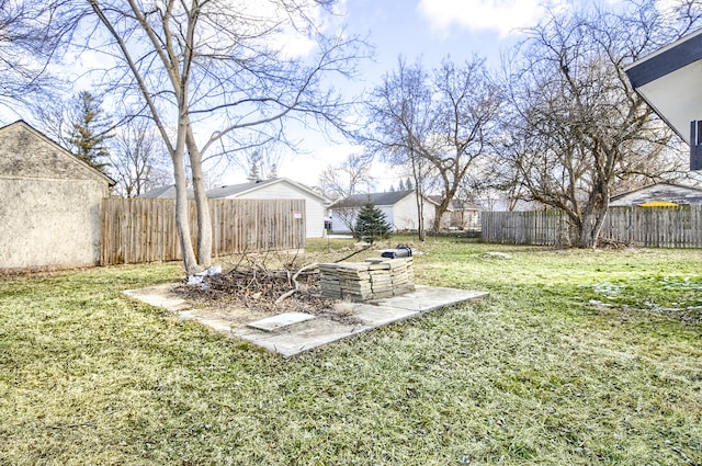 view of yard with a fenced backyard