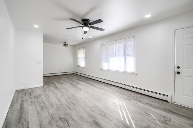 spare room featuring recessed lighting, wood finished floors, a ceiling fan, and baseboards