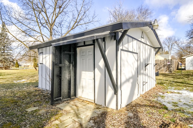 view of shed with fence