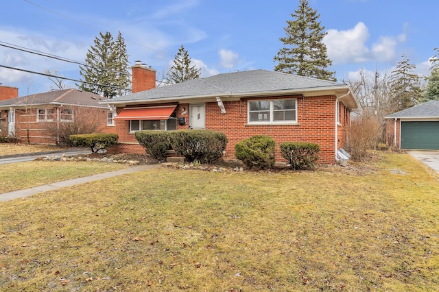 view of front of home featuring brick siding, roof with shingles, a chimney, an outdoor structure, and a front lawn