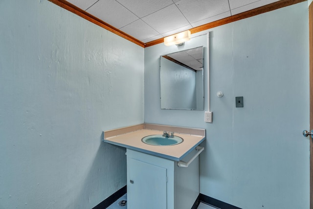 bathroom featuring a drop ceiling and vanity