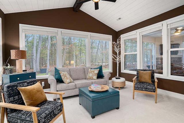 sunroom / solarium featuring vaulted ceiling with beams, visible vents, plenty of natural light, and a ceiling fan