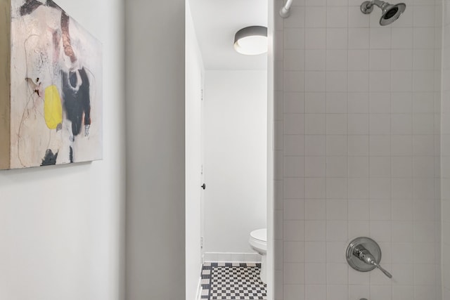 full bathroom with toilet and tile patterned floors