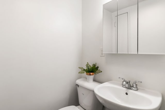 bathroom with a sink and toilet