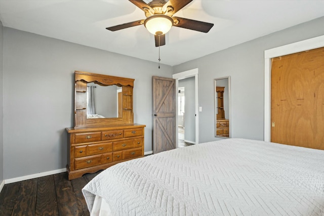 bedroom featuring a ceiling fan, baseboards, and wood finished floors