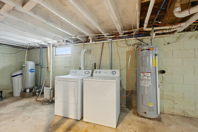 laundry area with laundry area, washer and dryer, and electric water heater