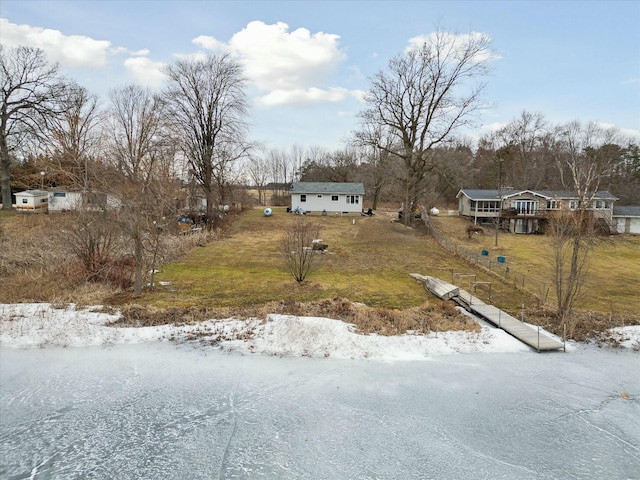 yard covered in snow with an outdoor structure