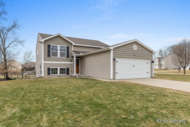 view of front of property featuring a garage, driveway, a front lawn, and fence