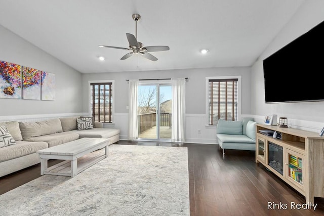 living room with ceiling fan, recessed lighting, a wainscoted wall, dark wood-style flooring, and vaulted ceiling