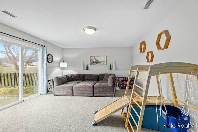 carpeted living area with visible vents