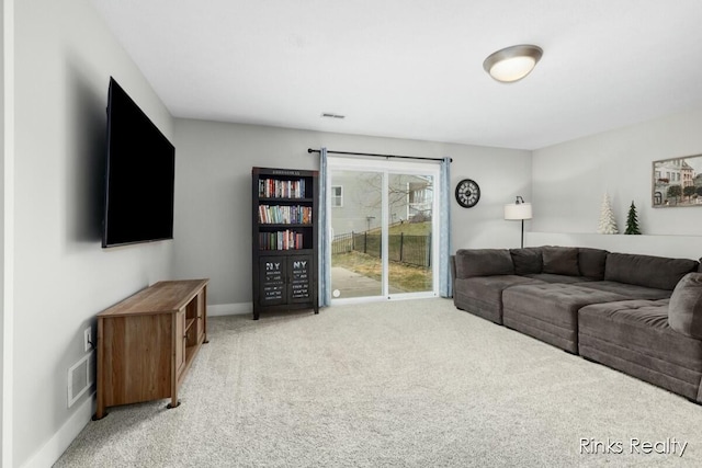 living area featuring light colored carpet, visible vents, and baseboards