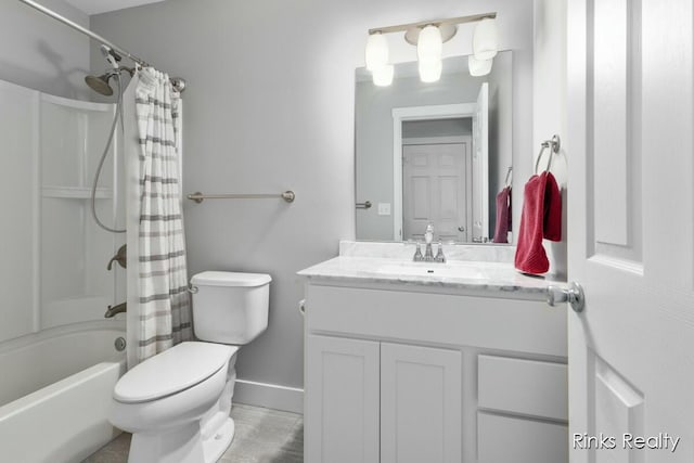 bathroom with shower / bath combo, vanity, toilet, and baseboards