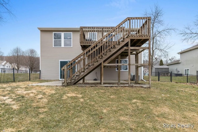 back of house featuring a yard, stairway, a fenced backyard, and a wooden deck