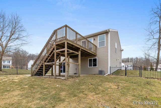 back of house featuring a lawn, stairs, fence, a deck, and central AC