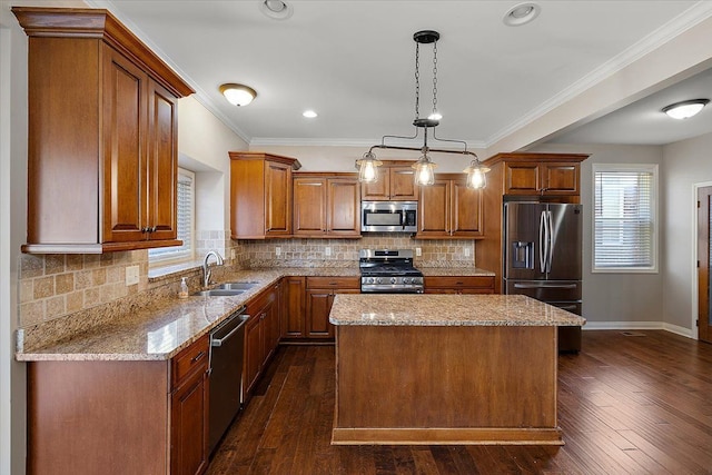 kitchen with a center island, light stone counters, dark wood-style floors, stainless steel appliances, and a sink