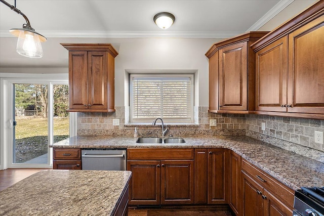 kitchen featuring stainless steel dishwasher, ornamental molding, a wealth of natural light, and a sink