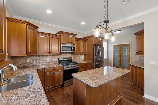 kitchen featuring dark wood-style floors, a sink, decorative backsplash, stainless steel appliances, and french doors