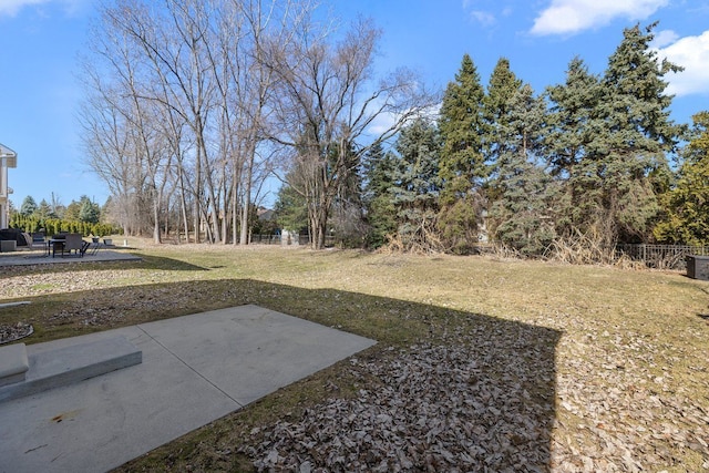 view of yard with a patio and fence