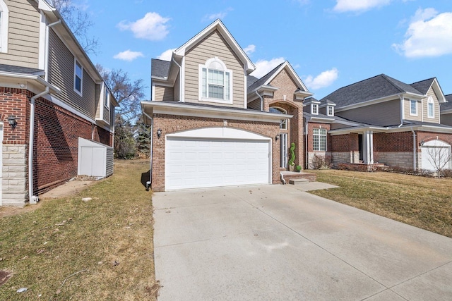 traditional-style house featuring concrete driveway, brick siding, and a front lawn