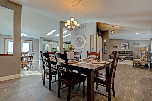 dining space with a chandelier, recessed lighting, visible vents, baseboards, and wood tiled floor