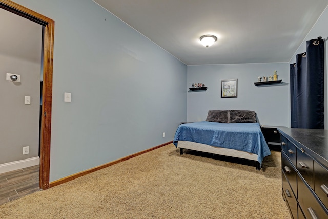 bedroom with carpet and baseboards