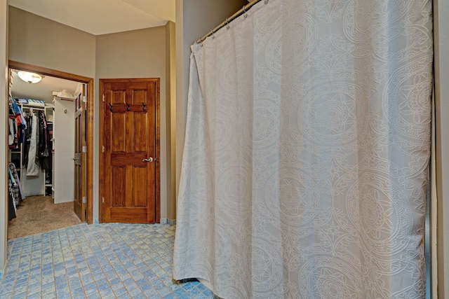 full bath featuring a spacious closet