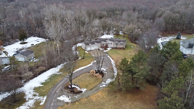 drone / aerial view featuring a forest view