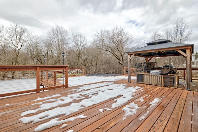 snow covered deck featuring a gazebo