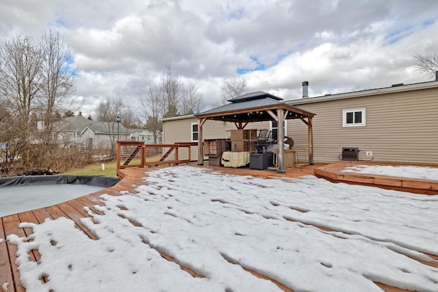 exterior space featuring a gazebo and a wooden deck