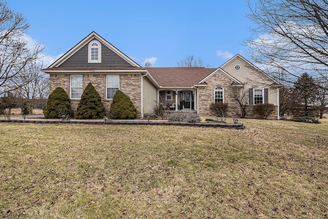 view of front of property featuring brick siding and a front yard