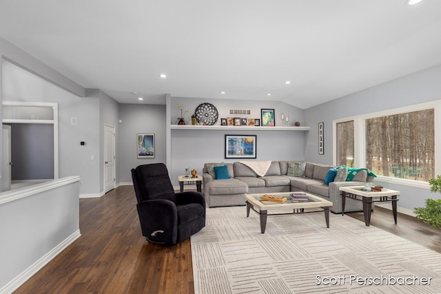 living area featuring dark wood-type flooring, lofted ceiling, baseboards, and recessed lighting