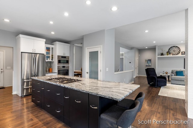 kitchen featuring stainless steel appliances, dark wood-style flooring, recessed lighting, and white cabinets