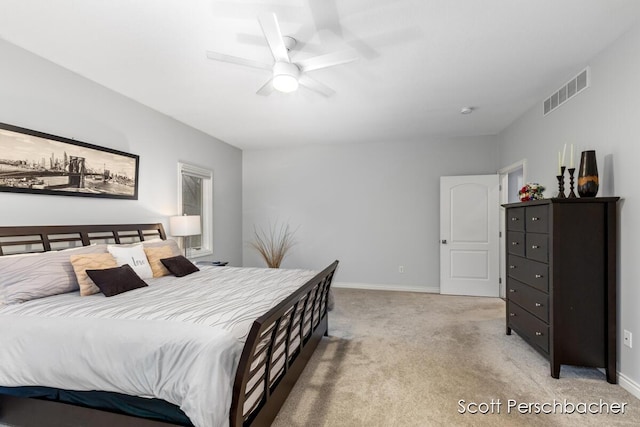 bedroom featuring light carpet, a ceiling fan, visible vents, and baseboards