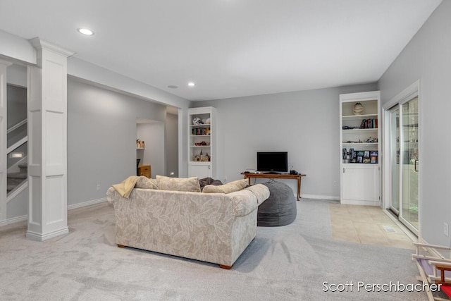 living area featuring light carpet, baseboards, and recessed lighting