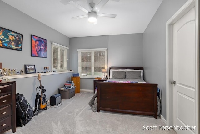 carpeted bedroom featuring a ceiling fan and baseboards