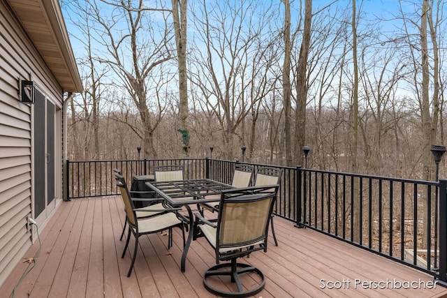 wooden deck with outdoor dining area