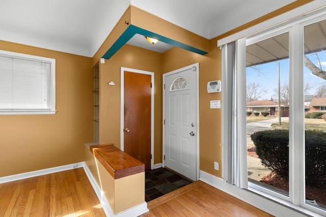 entrance foyer featuring wood finished floors and baseboards