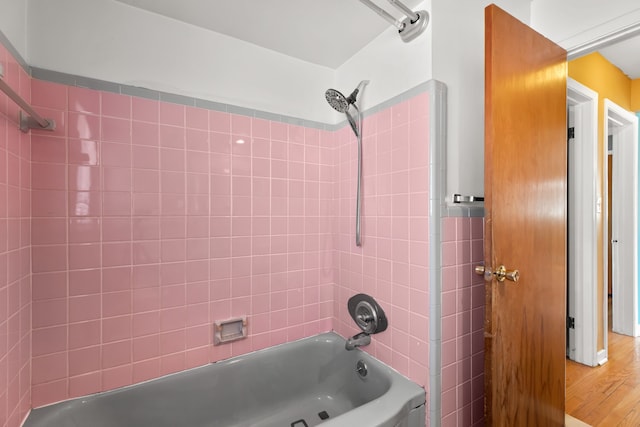 full bathroom featuring shower / bathing tub combination and wood finished floors