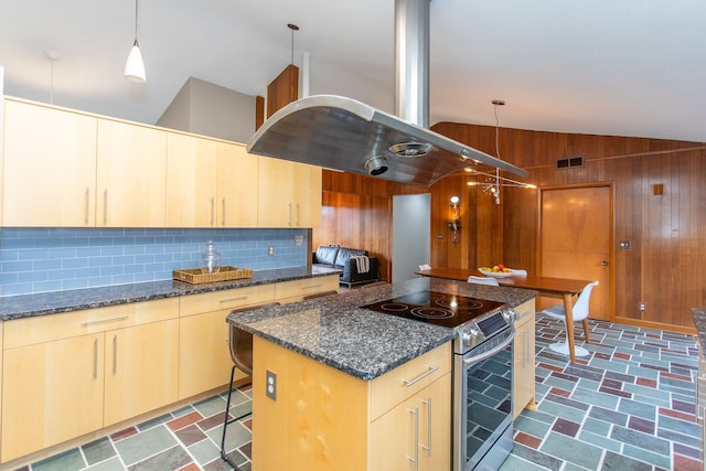 kitchen with wooden walls, vaulted ceiling, decorative backsplash, stainless steel electric range oven, and light brown cabinetry