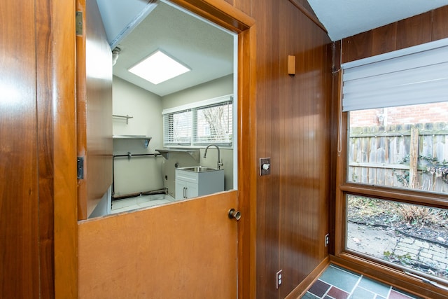 interior space featuring vaulted ceiling and a sink