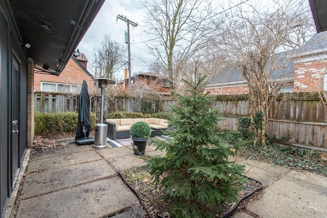 view of patio / terrace featuring an outdoor hangout area and a fenced backyard