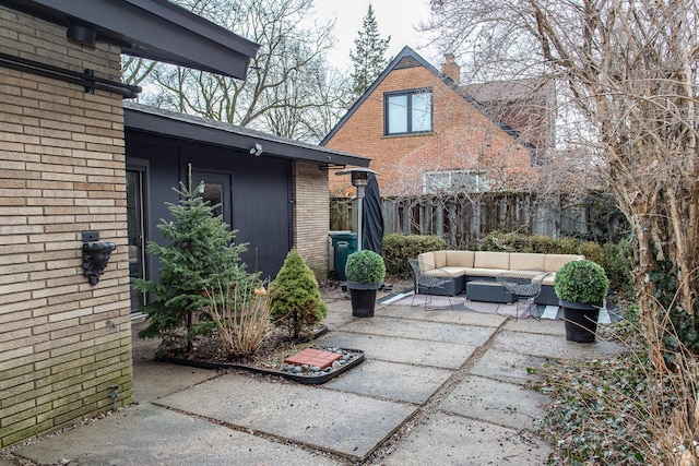 view of patio / terrace featuring fence and an outdoor hangout area