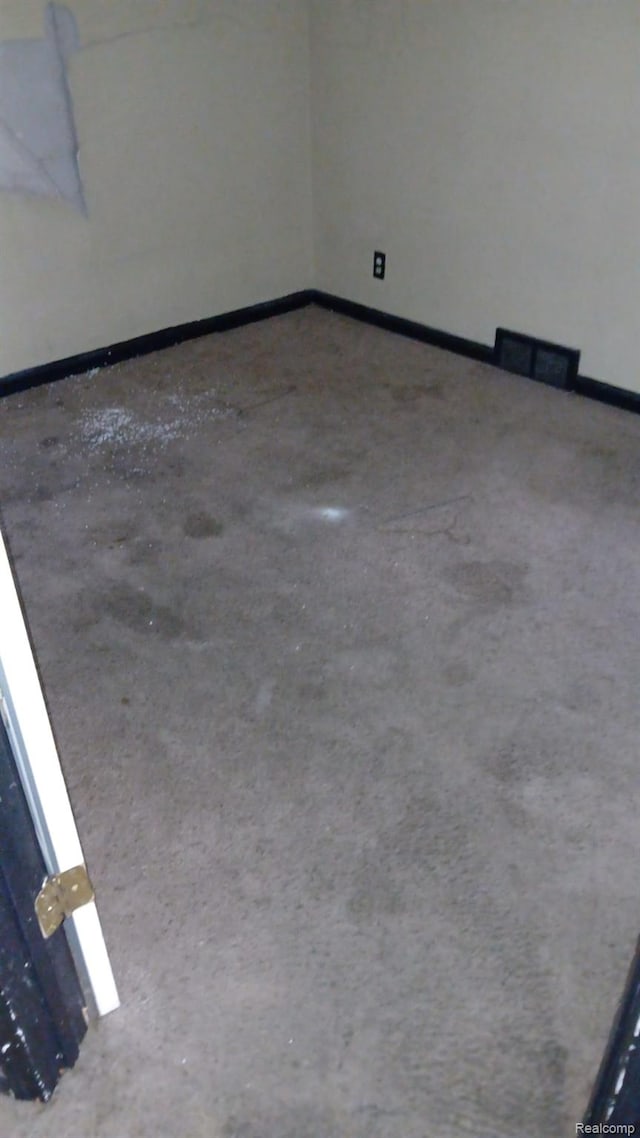 9437 Beaconsfield St, Detroit, MI 48224 - empty room featuring baseboards and concrete floors
