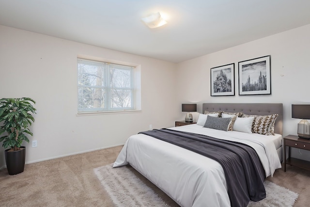 bedroom with carpet flooring and baseboards