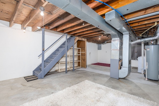 unfinished below grade area featuring gas water heater, stairway, heating unit, and electric panel