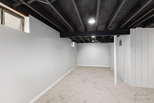 basement featuring carpet floors and visible vents