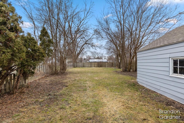 view of yard with a fenced backyard